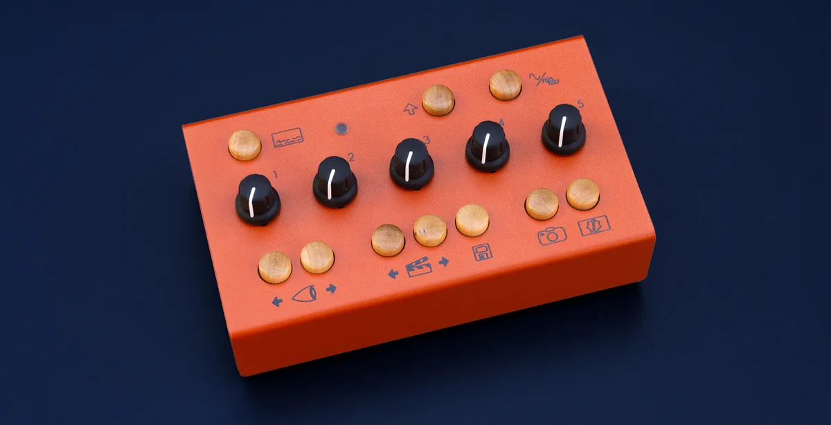 Orange EYESY video synthesizer with five black knobs and wooden buttons on its top panel, seen at an angle