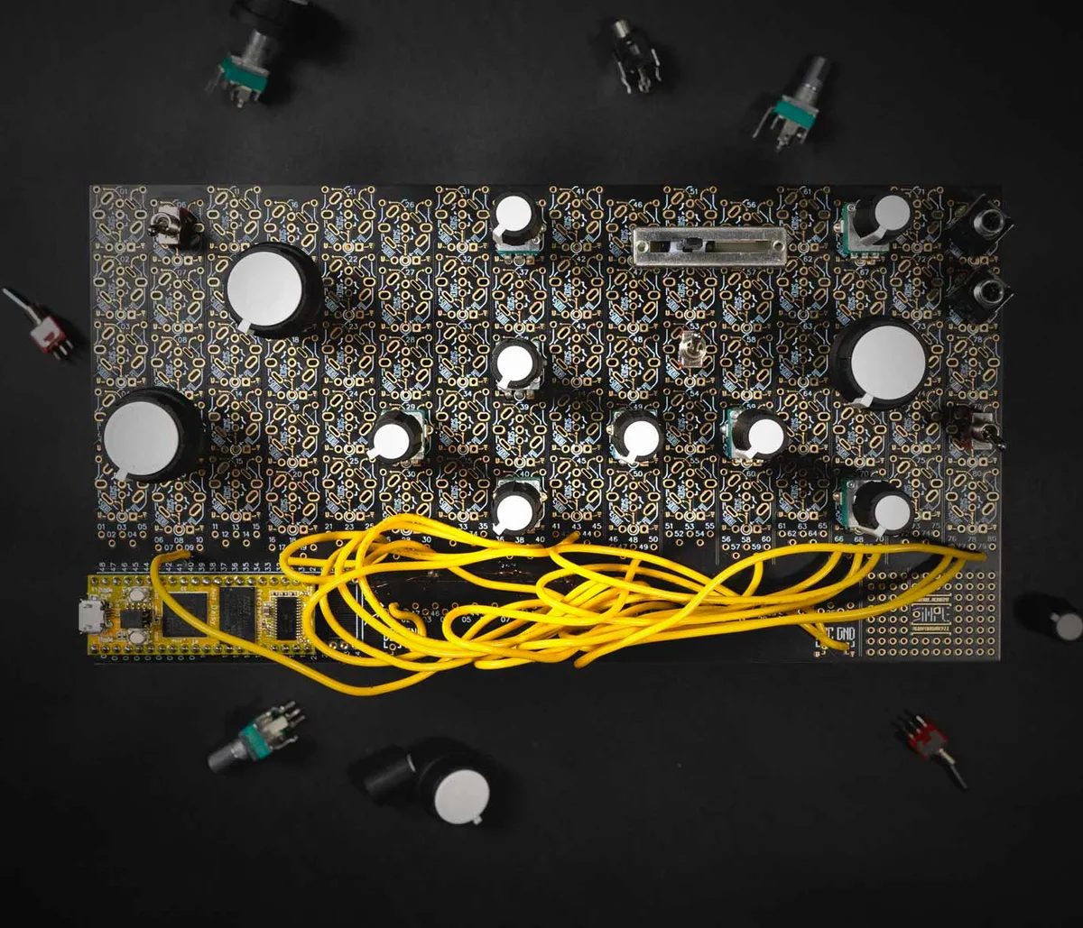 Simple Designer kit from above, with the populated board, knobs, switches and yellow wires